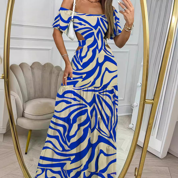 a lady wearing blue solid botanical printed long dress with drop shoulders and cut out waist design