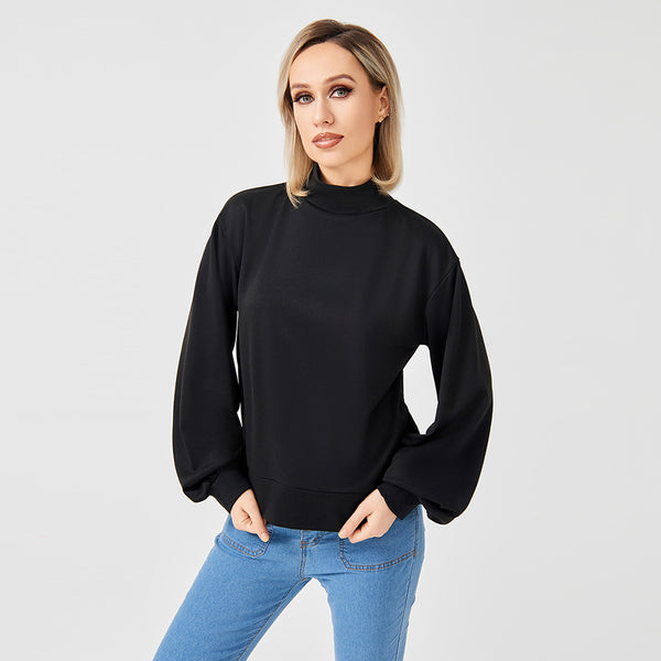 A lady wearing black high neck sweatshirt