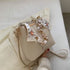 shoulder bag with chain and cloth bow in light brown colour