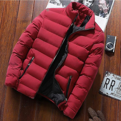 Red puffer jacket displayed on a wooden background
