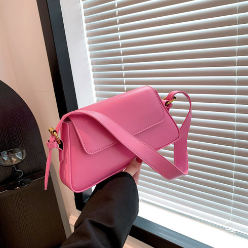 Pink messenger bag with adjustable strap