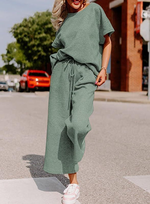 light green Jumpsuit, short sleeves, wide trouser with string closure