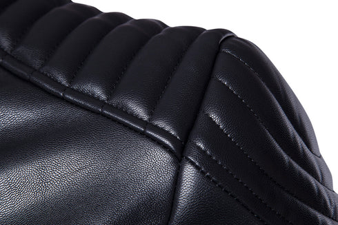 closeup view of shoulders of black leather jacket, pleated and puffy