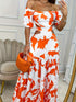 a lady wearing orange red solid botanical printed long dress with drop shoulders and cut out waist design