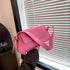 Pink messenger bag with adjustable strap
